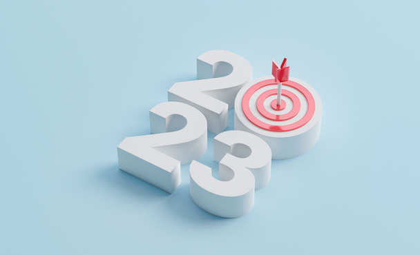 2023 letters with bullseye target and arrow on the letter 0
